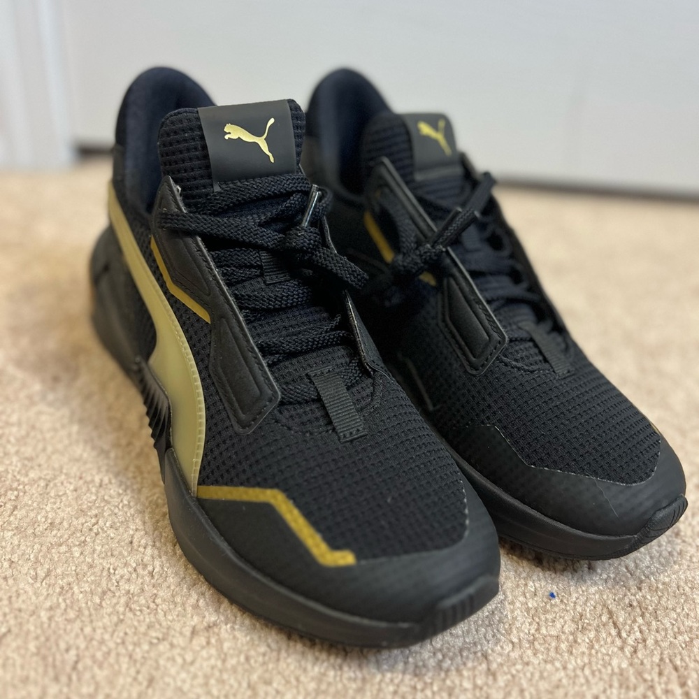 Puma Black and Gold Sneakers